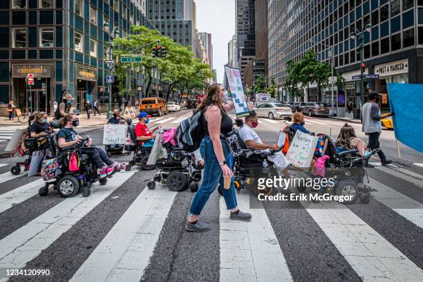 Participants on a wheelchairs seen protesting outside Governor Andrew Cuomo's office. Members of Downstate New York ADAPT gathered outside of...