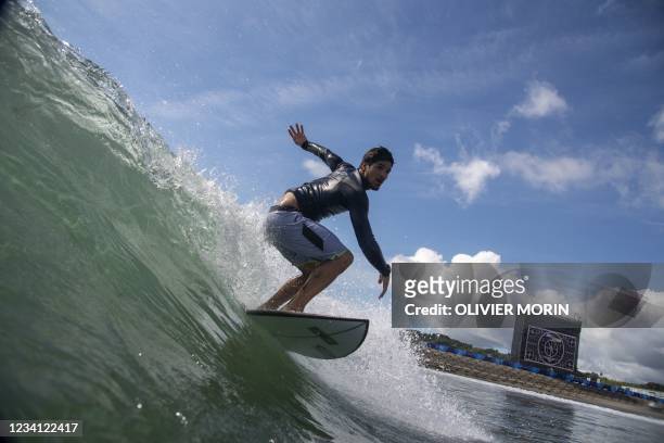 Brazil's Gabriel Medina rides a wave during a free training at the Tsurigasaki Surfing Beach, in Chiba, on July 23, 2021 during the Tokyo 2020...