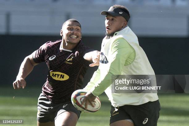 South Africa's fly-half Damian Willemse fight for the ball with South Africa's fly-half Elton Jantjies during the Springboks training session in Cape...