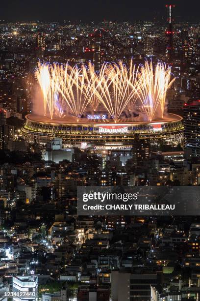 Fireworks light up the sky over the Olympic Stadium during the opening ceremony of the Tokyo 2020 Olympic Games, in Tokyo, on July 23, 2021.