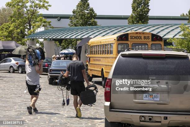 Members of the crew carry lighting equipment on the 'Miami' set of Hollywood movie "The Enforcer" during a media day at the German School in...