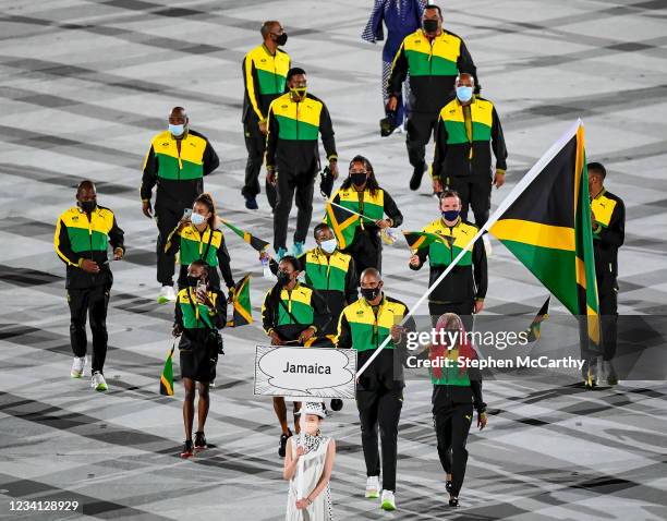 Tokyo , Japan - 23 July 2021; Team Jamaica flagbearers Shelly-Ann Fraser-Pryce and Ricardo Brown carry the Jamaican flag during the 2020 Tokyo Summer...