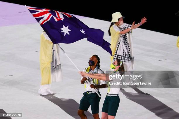 Australia enter the arena with flag bearers Patty Mills and Cate Campbell during the Opening Ceremony of the Tokyo 2020 Olympic Games at Olympic...