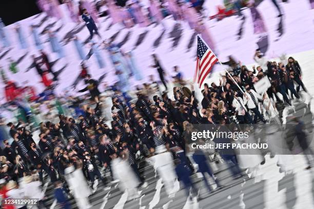 S flag bearer Sue Bird and USA's flag bearer Eddy Alvares lead the delegation during the opening ceremony of the Tokyo 2020 Olympic Games, at the...