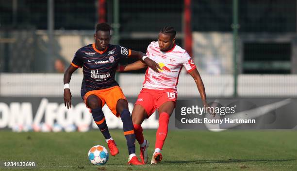 Christopher Nkunku of RB Leipzig and Ambroise Oyongo of Montpellier vie for the ball during the pre-season friendly match between RB Leipzig and HSC...