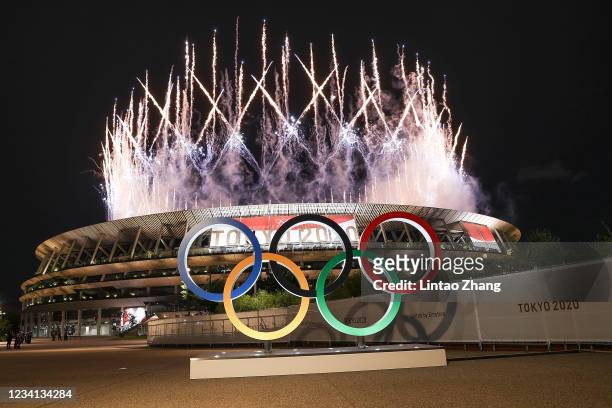 The Olympic Rings are seen outside the stadium as fireworks go off during the Opening Ceremony of the Tokyo 2020 Olympic Games at Olympic Stadium on...