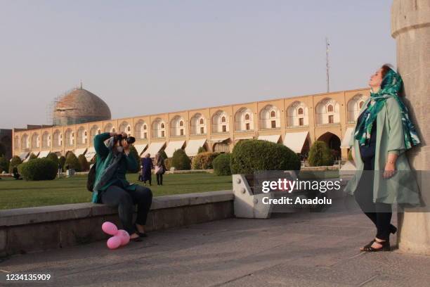Women take photo at Naqsh-e Jahan Square, one of UNESCO's World Heritage Sites, in Isfahan, Iran on July 23, 2021.