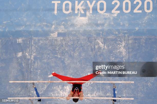 Russia's David Belyavskiy competes in the parallel bars event of the artistic gymnastics men's qualification during the Tokyo 2020 Olympic Games at...
