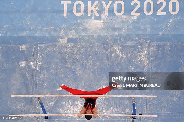 Russia's David Belyavskiy competes in the parallel bars event of the artistic gymnastics men's qualification during the Tokyo 2020 Olympic Games at...