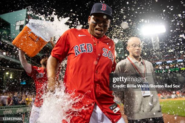 Rafael Devers of the Boston Red Sox is doused with Gatorade after a game against the New York Yankees on July 23, 2021 at Fenway Park in Boston,...