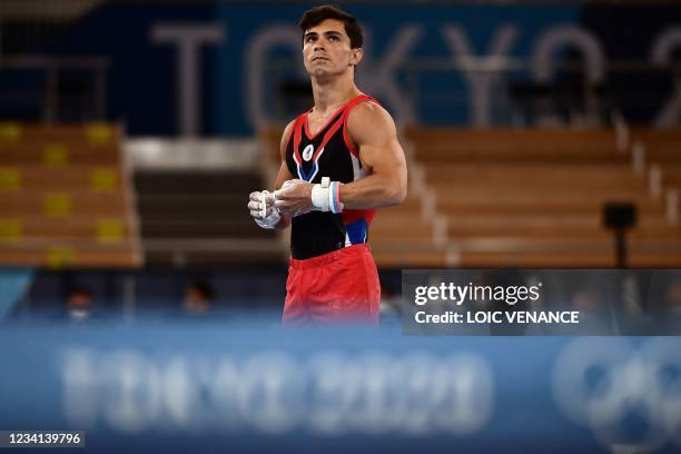 Russia's Denis Abliazin gets ready to compete in the rings event of the artistic gymnastics men's qualification during the Tokyo 2020 Olympic Games...