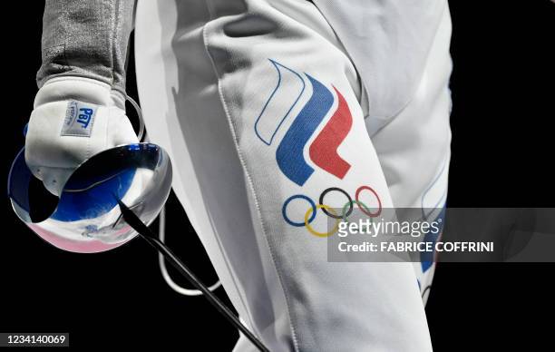 The Russia's Olympic Committee logo is pictures on an athlet during men's sabre individual qualifying bout during the Tokyo 2020 Olympic Games at the...