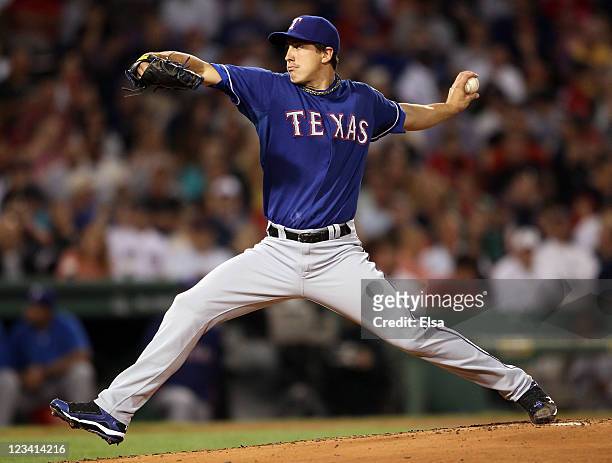 Derek Holland of the Texas Rangers delivers a pitch in the first inning against the Boston Red Sox on September 2, 2011 at Fenway Park in Boston,...
