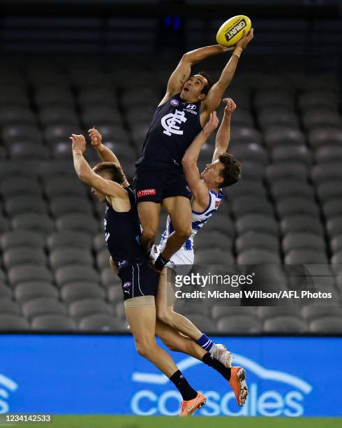Eddie Betts of the Blues attempts a spectacular mark over Patrick Cripps of the Blues and Kayne Turner of the Kangaroos during the 2021 AFL Round 19...