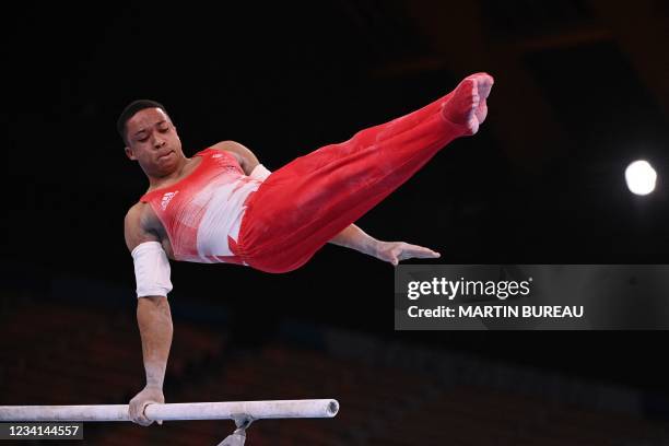 Britain's Joe Fraser competes in the parallel bars event of the artistic gymnastics men's qualification during the Tokyo 2020 Olympic Games at the...