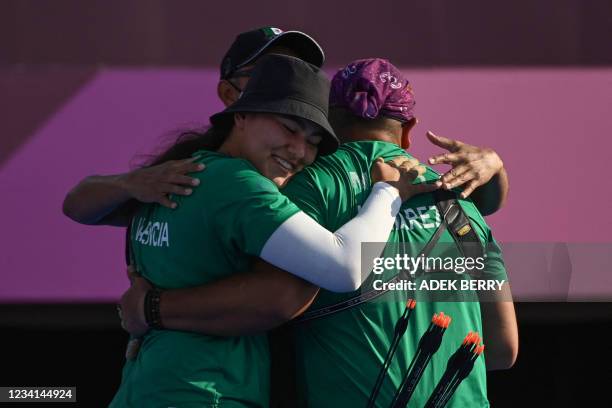 Mexico's Alejandra Valencia and Luis Alvarez celebrate their victory against Turkey in the mixed team bronze medal match during the Tokyo 2020...