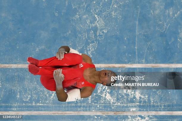 Britain's Joe Fraser competes in the parallel bars event of the artistic gymnastics men's qualification during the Tokyo 2020 Olympic Games at the...