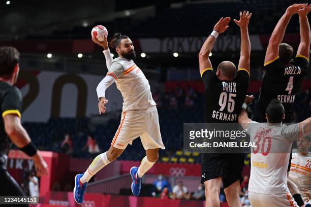 Spain's right back Jorge Maqueda jumps to shoot during the men's preliminary round group A handball match between Germany and Spain of the Tokyo 2020...
