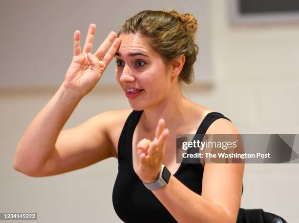 Sign language interpreter, Mandy Welly, acts out her part during a rehearsal for the musical "Dear Evan Hansen" at The Kennedy Center.