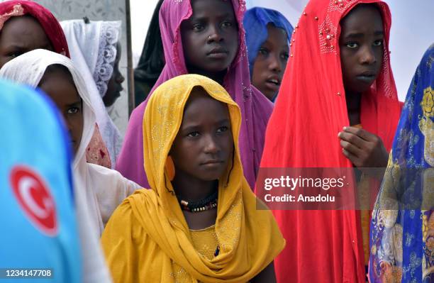 Chadian people gather around clean water in N'Djamena, Chad on July 23, 2021. With the donations of Turkish benefactors and under the leadership of...