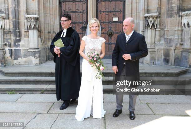 Bride Andrea Kathrin Loewig and her husband Andreas Thiele after their wedding ceremony on July 24, 2021 at Thomaskirche in Leipzig, Germany.