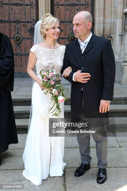 Bride Andrea Kathrin Loewig and her husband Andreas Thiele after their wedding ceremony on July 24, 2021 at Thomaskirche in Leipzig, Germany.