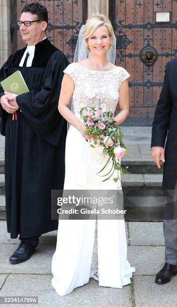 Bride Andrea Kathrin Loewig and her husband Andreas Thiele after their wedding ceremony on July 24, 2021 at Thomaskirche in Leipzig, Germany.