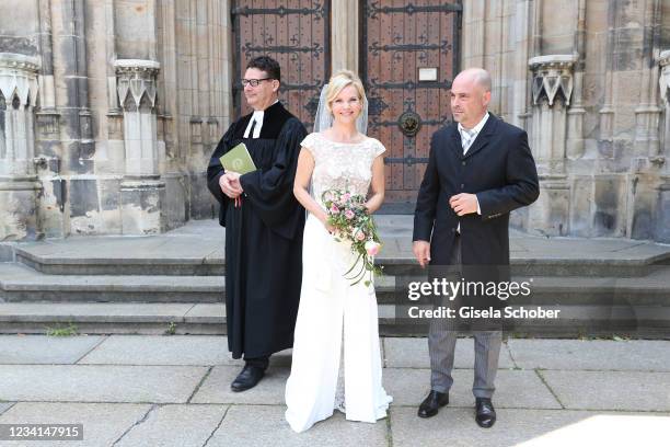 Bride Andrea Kathrin Loewig and her husband Andreas Thiele after their wedding ceremony on July 24, 2021 at Thomaskirche in Leipzig, Germany.