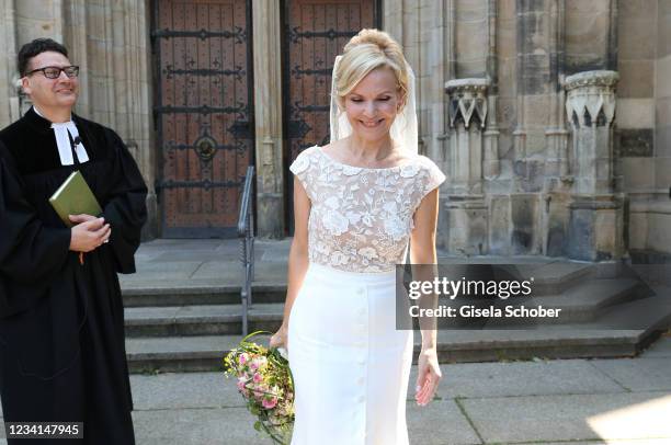 Bride Andrea Kathrin Loewig and her husband Andreas Thiele after their wedding ceremony on July 24, 2021 at Thomaskirche in Leipzig, Germany.