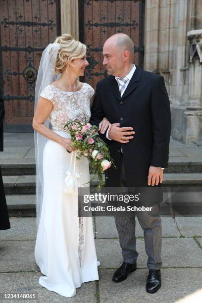 Bride Andrea Kathrin Loewig and her husband Andreas Thiele after their wedding ceremony on July 24, 2021 at Thomaskirche in Leipzig, Germany.