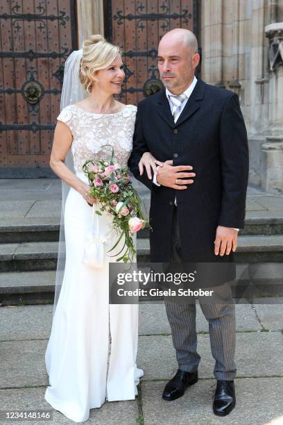 Bride Andrea Kathrin Loewig and her husband Andreas Thiele after their wedding ceremony on July 24, 2021 at Thomaskirche in Leipzig, Germany.