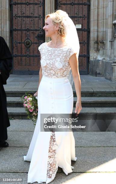 Bride Andrea Kathrin Loewig and her husband Andreas Thiele after their wedding ceremony on July 24, 2021 at Thomaskirche in Leipzig, Germany.