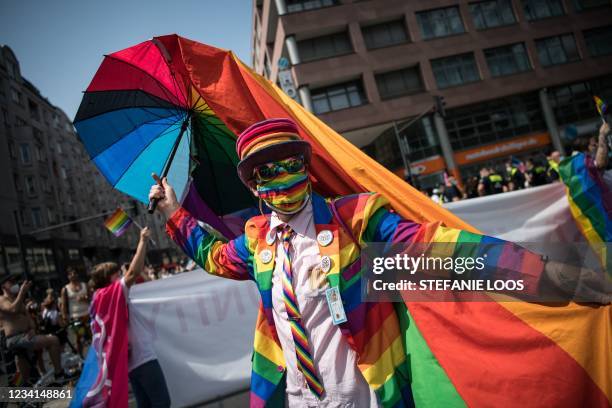 Participant takes part in the annual Christopher Street Day parade with the motto "Save Our Community- Save Your Pride" on July 24 amid the ongoing...