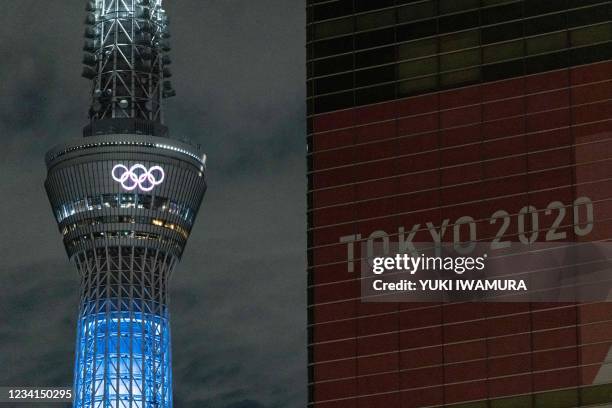 The Olympic rings are illuminated on Tokyo Skytree in Tokyo on July 24, 2021.