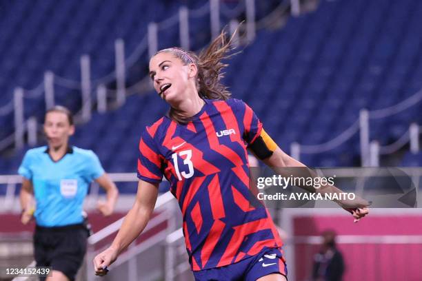 S forward Alex Morgan celebrates after scoring the fifth goal during the Tokyo 2020 Olympic Games women's group G first round football match between...