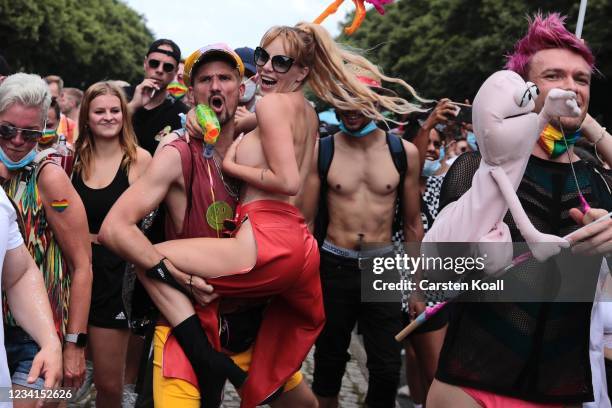 Participants take part in the annual Christopher Street Day parade on July 24, 2021 in Berlin, Germany. The Christopher Street Day parade is held in...