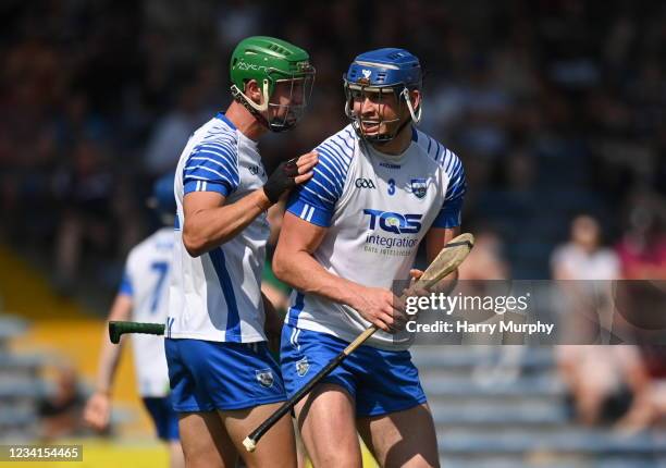 Tipperary , Ireland - 24 July 2021; Conor Prunty, right, and Michael Kiely of Waterford react at the full-time whistle after the GAA Hurling...