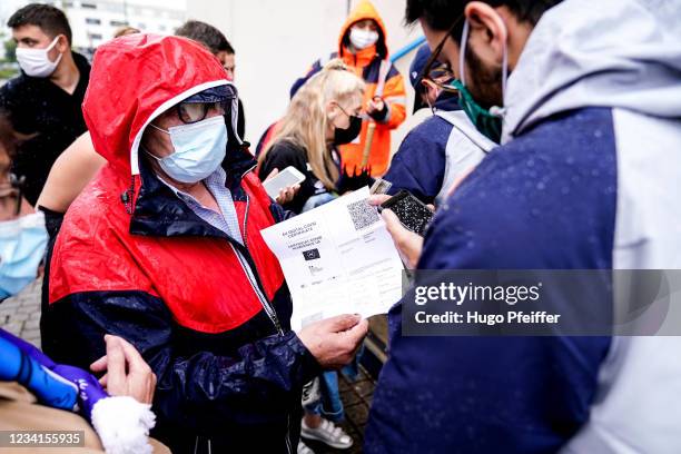 Health Pass Check during the Ligue 2 football match between SM Caen and Rodez at Stade Michel D'Ornano on July 24, 2021 in Caen, France.