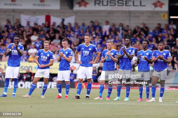 Leicester City players watch the penalty shoot out from the centre circle during the Pre-Season friendly between Burton Albion and Leicester City at...