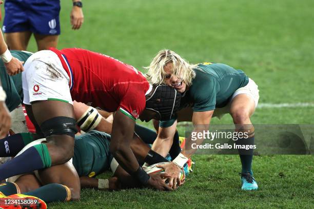 Faf de Klerk of the Springboks and Maro Itoje of the B&I Lions fight for the ball at the bottom of a ruck during the Castle Lager Lions Series 1st...