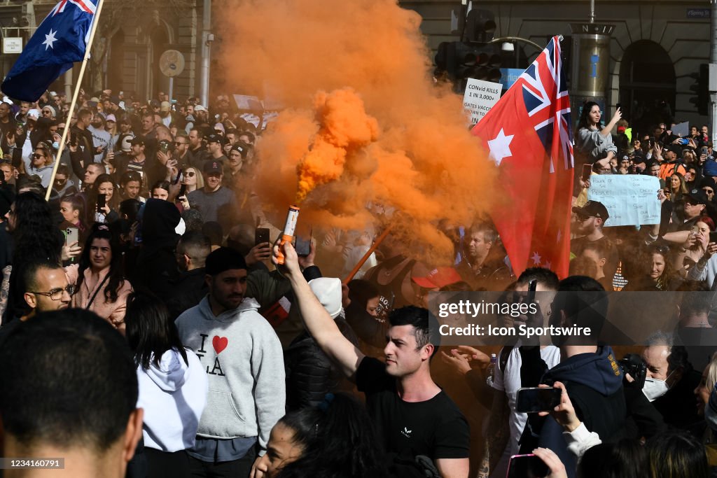 Freedom Rally Melbourne A protester with a smoke flare on Spring Street during the Freedom ...