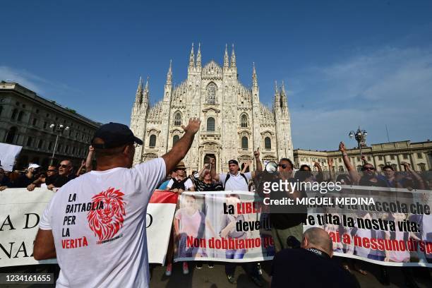 Protesters take part in a demonstration on Piazza Duomo in Milan on July 24 against the introduction of a mandatory 'green pass' for indoor dining...