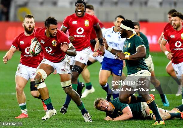 Cape Town , South Africa - 24 July 2021; Courtney Lawes of British and Irish Lions evades the tackle of Siya Kolisi of South Africa during the first...