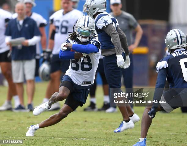 Wide receiver CeeDee Lamb of the Dallas Cowboys carries the ball during training camp at River Ridge Complex on July 24, 2021 in Oxnard, California.