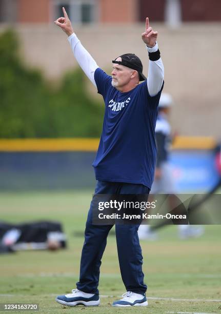 Defensive coordinator Dan Quinn of the Dallas Cowboys encourages players during training camp on July 24, 2021 in Oxnard, California.