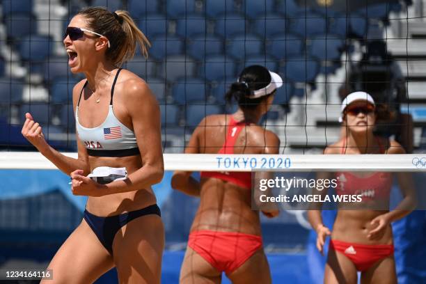 S Alix Klineman celebrates, as China's Xue Chen and China's Wang Xinxin react, in their women's preliminary beach volleyball pool B match between the...