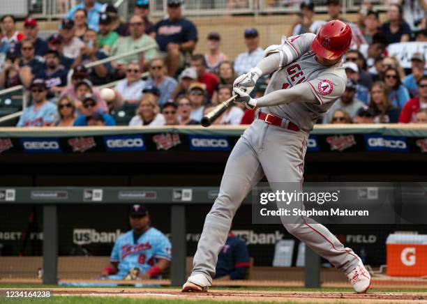 Shohei Ohtani of the Los Angeles Angels hits a double in the first inning of the game against the Minnesota Twins at Target Field on July 24, 2021 in...