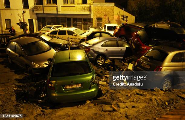 Damaged cars are piled up in Belgium's Dinant after heavy rain and floods caused major damage on July 24, 2021.