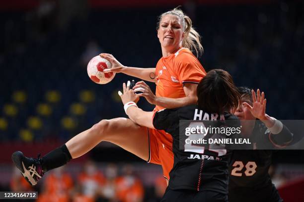Netherlands' centre back Nycke Groot jumps to shoot during the women's preliminary round group A handball match between The Netherlands and Japan of...