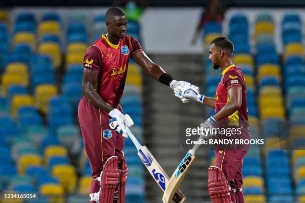 Jason Holder and Nicholas Pooran of West Indies 50 runs partnership during the 2nd ODI between West Indies and Australia at Kensington Oval,...